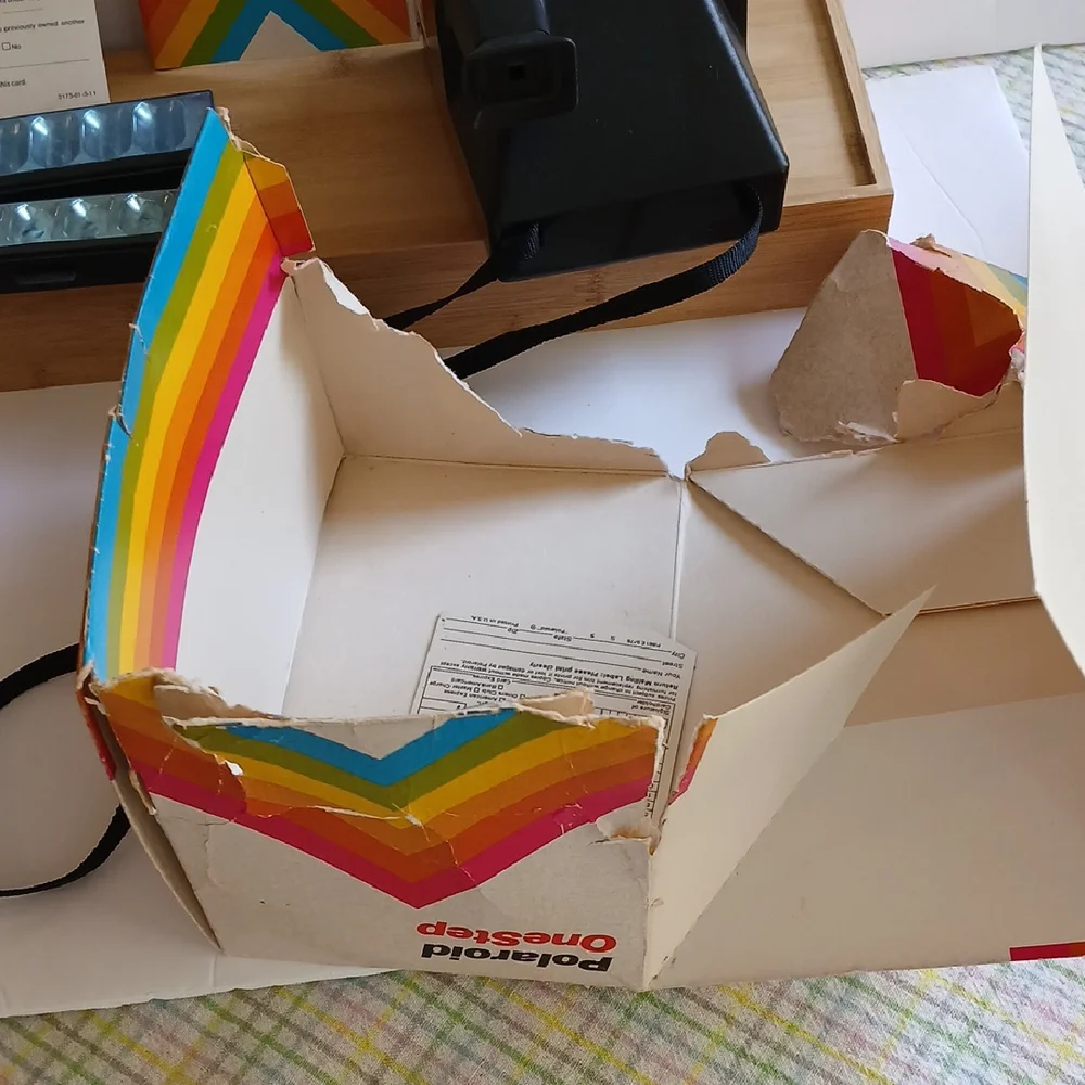 Vintage Polaroid Land One Step Instant Film Camera with Iconic Rainbow Design